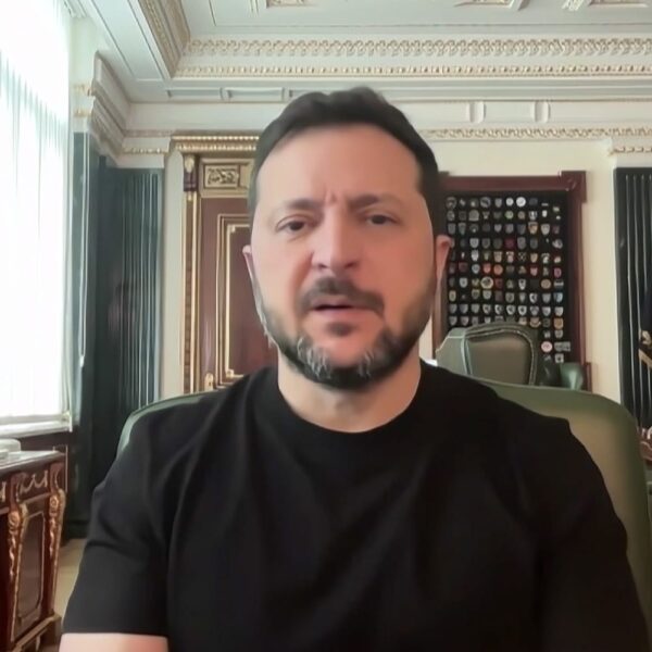 Ukrainian President Volodymyr Zelenskyy in a black shirt speaking from his office in Kyiv